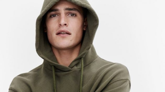 Parker van Noord rocks a green hoodie for Marc O'Polo's fall-winter 2020 campaign.