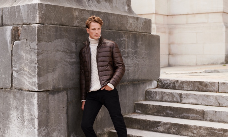 Going casual, Hugo Sauzay sports a turtleneck cable-knit sweater with a quilted jacket from Massimo Dutti.