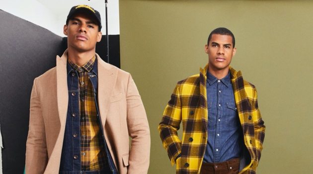 Clad in yellow and checks, Vitor Melo is ready to turn heads in Todd Snyder's Italian Buffalo plaid two-collar topcoat and mustard plaid flannel button-down shirt.