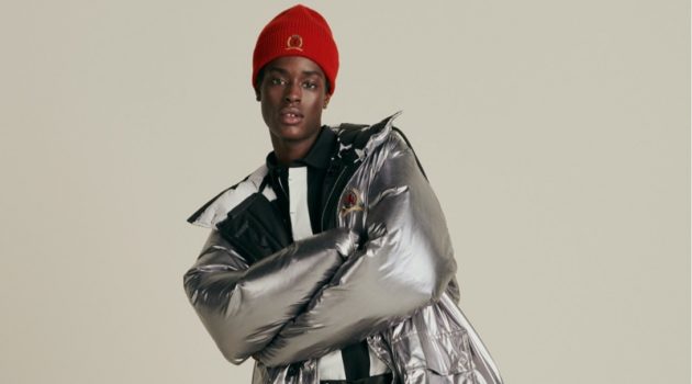 Making a grand style statement, Babacar N'doye dons a Hilfiger Collection reversible Re:Down parka and skinny rock belt.