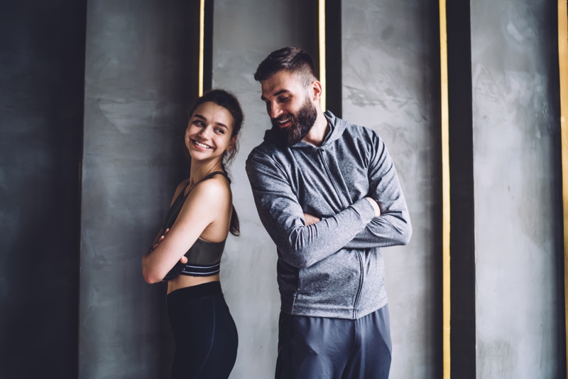 https://www.thefashionisto.com/wp-content/uploads/2020/12/Smiling-Couple-Wearing-Activewear.jpg