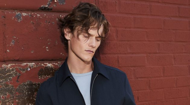 Ryan Keating dons a smart matching look in navy from Theory's spring-summer 2021 collection.