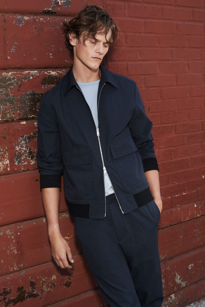 Ryan Keating dons a smart matching look in navy from Theory's spring-summer 2021 collection.