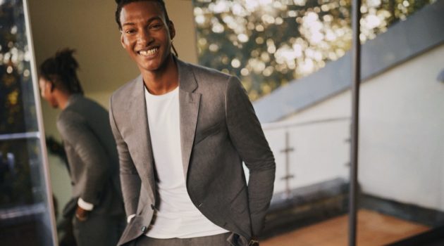 All smiles, Ty Ogunkoya suits up for Tommy Hilfiger's holiday 2020 campaign.