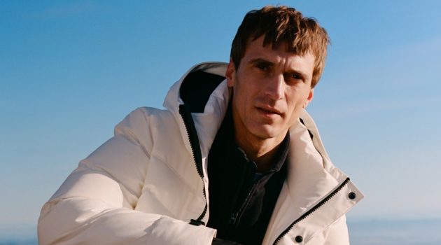 Clément Chabernaud sports puffer jacket with a half-zip pullover and pants from Mango Man's Improved collection.