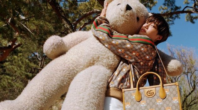 Kai poses with an oversized teddy bear in the campaign for his new Gucci capsule collection.