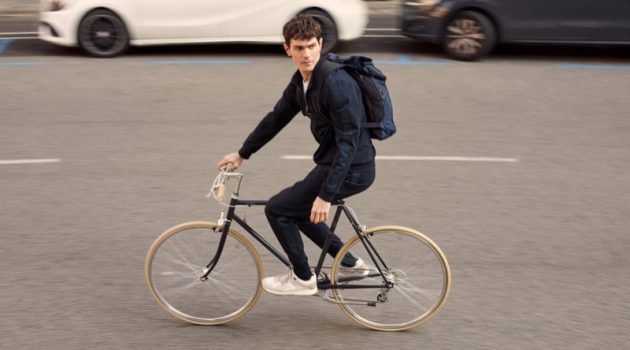 Going for a bike ride, Vincent Lacrocq models pieces from Mango's High-Performance collection.