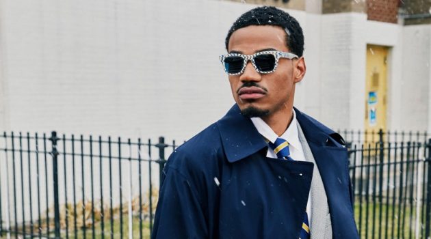 Sporting a dapper look, Tyshawn Jones wears his Harris checkered bone and whirlpool sunglasses, made in collaboration with Warby Parker.