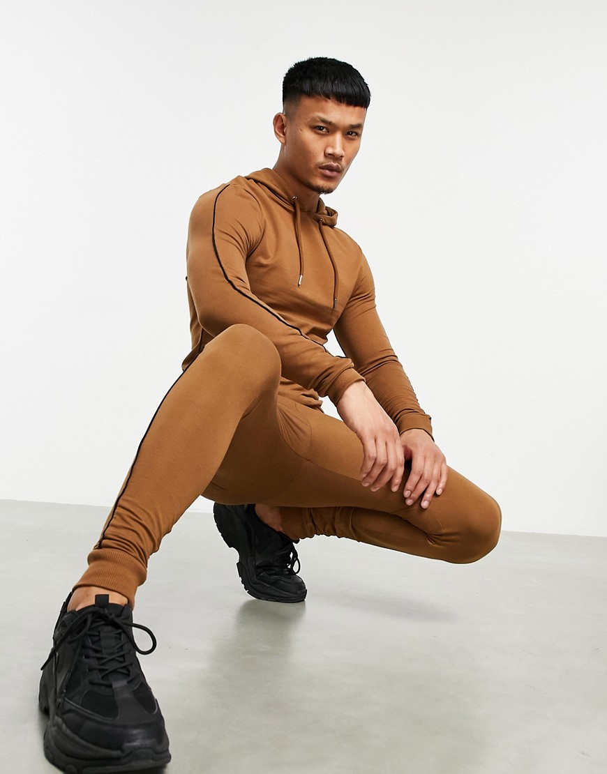 ASOS DESIGN organic muscle tracksuit with hoodie in brown with black ...