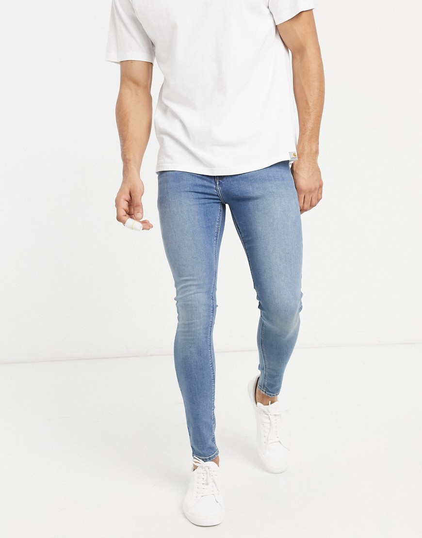 ASOS DESIGN spray on jeans with power stretch in dirty mid wash blue ...