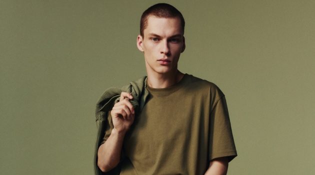 Andreas wears a pleated oversized top with pants from Zara.