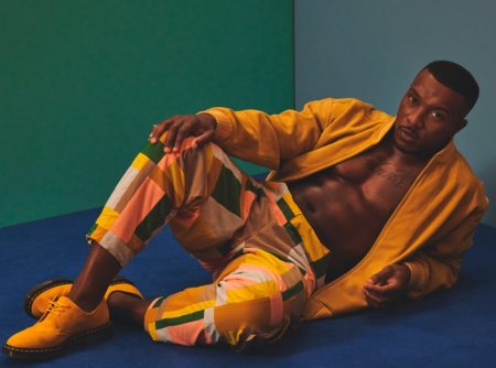 Hitting the studio for Hunger magazine, Ashley Walters wears a Lavin's Vintage Clothing jacket with KA Wakey pants and Dr Martens shoes.