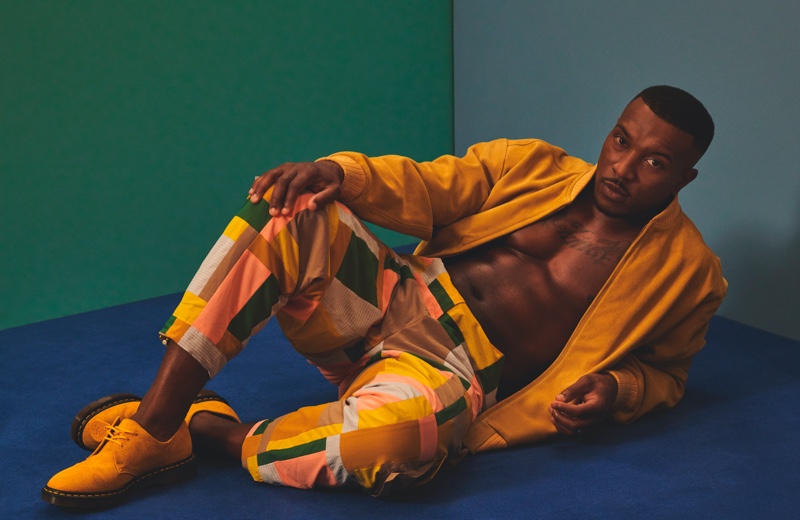 Hitting the studio for Hunger magazine, Ashley Walters wears a Lavin's Vintage Clothing jacket with KA Wakey pants and Dr Martens shoes.