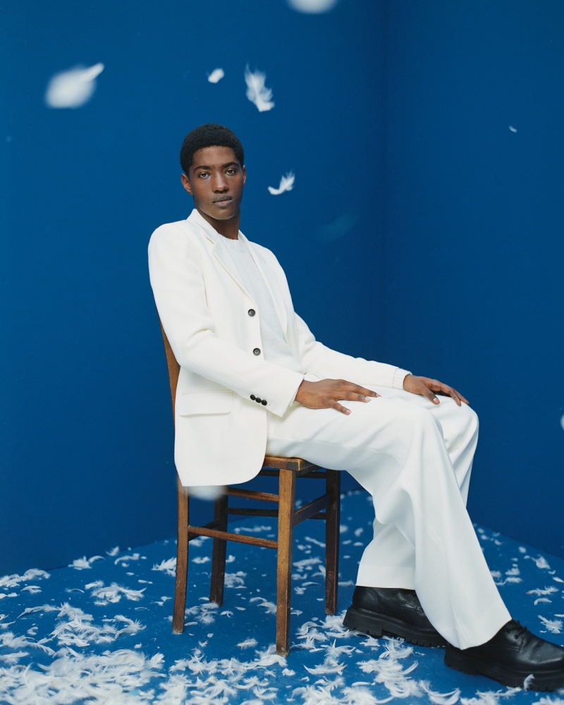 A striking vision, Diogo Gomes models a white suit from AMI Paris.