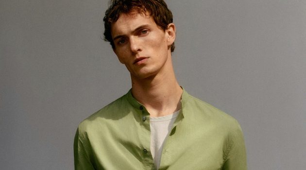 Hitting the studio, Luc Defont-Saviard dons a COS grandad collar shirt with regular-fit jeans.