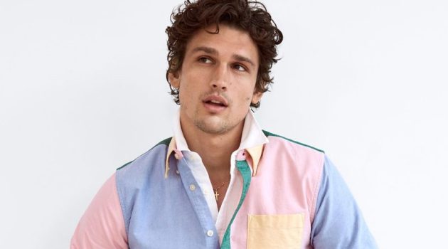 A preppy vision, Simon Nessman models a LE 31 multi-colored oxford shirt with denim jeans from Simons.