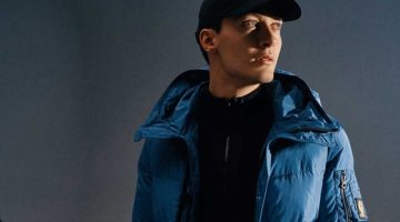 George Russell sports a blue quilted Belstaff jacket.