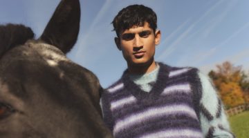 Neeraj Saini wears a striped mohair-blend sweater vest over an intarsia mohair-blend sweater from the Marni x Mytheresa capsule collection.