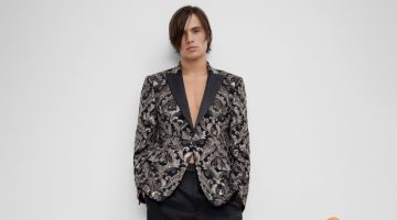 Louis Baines makes a sartorial statement in a jacquard jacket with tailored trousers.