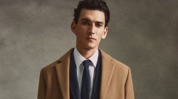 Thibaud Charon dons Mango's camel coat with an elegant suit, shirt, and tie.