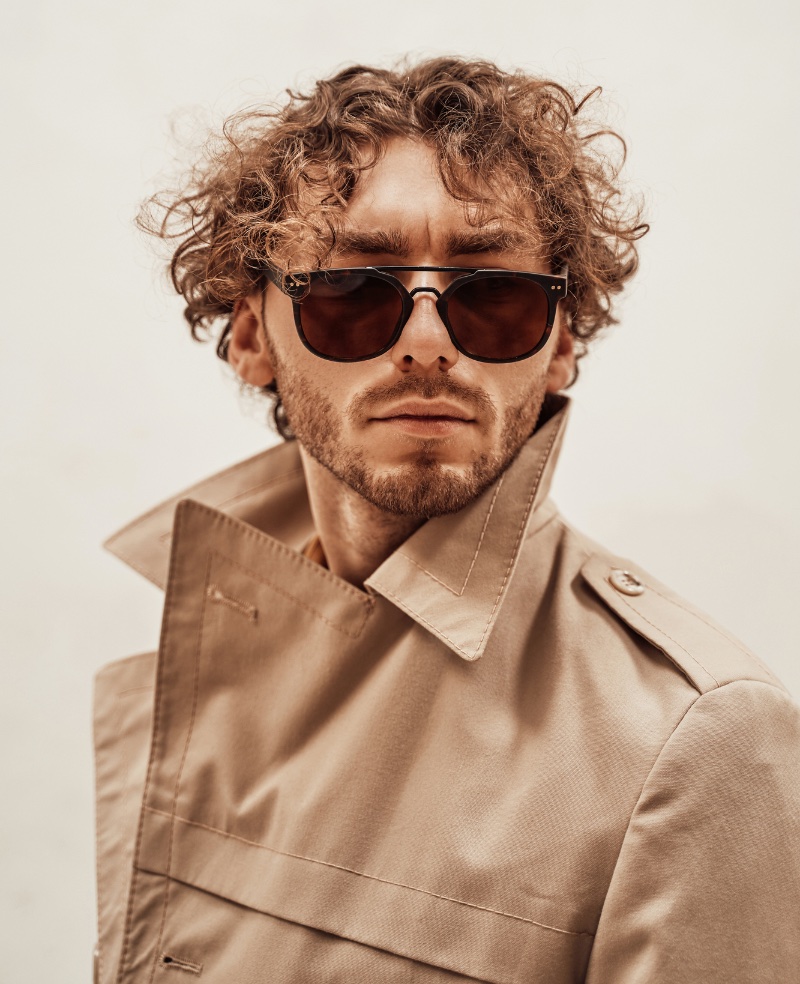 man with curly hair cropped look glasses fashion studio Stock Photo - Alamy