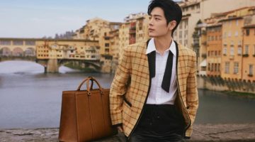 Xiao Zhan wears a Gucci check cotton-linen formal jacket as he poses alongside a GG embossed tote bag.