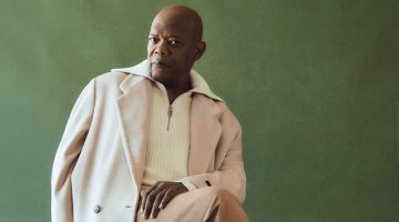 A chic vision, Samuel L. Jackson dons a Fear of God oversized double-breasted coat with a RÒHE half-zip sweater, Zegna camel hair and cotton-blend sweatpants, and Dries Van Noten loafers.