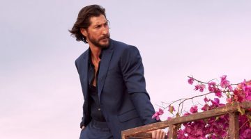 Ryan Porter models a navy suit with a black shirt for Banana Republic's summer 2023 campaign.