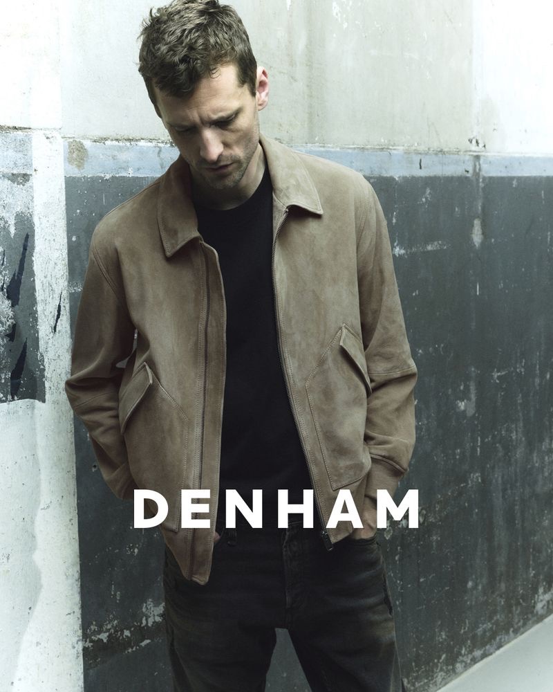 British model George Barnett sports a suede bomber jacket for DENHAM's fall-winter 2023 campaign.