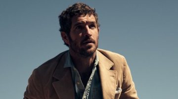 Model Justice Joslin wears a corduroy jacket with denim jeans.