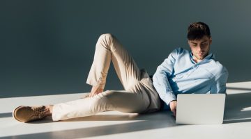 Man Looking at Laptop Studio Featured