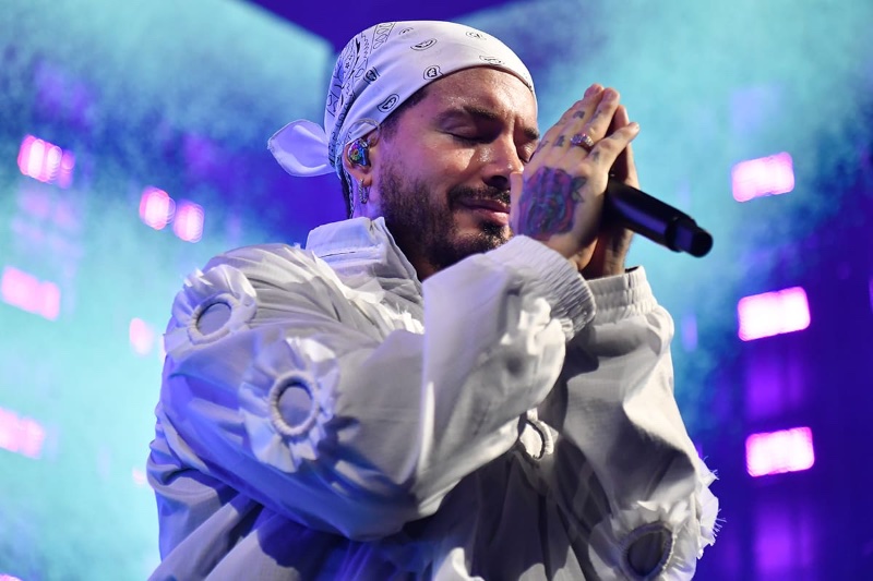 J Balvin closes his eyes, feeling the music, while performing on stage at the G-SHOCK 40th anniversary concert.