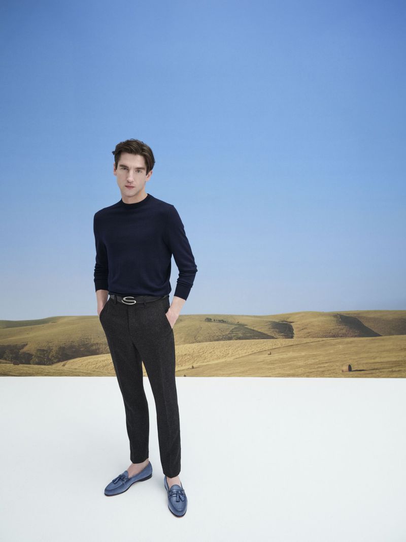 Anatol Modzelewski poses against an expansive sky in Santoni's spring-summer 2024 campaign.