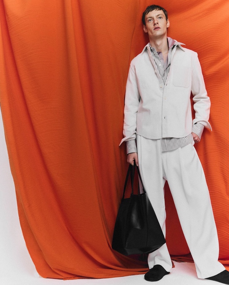 Starring in a LuisaViaRoma feature, Roberto Sipos wears a Zegna overshirt with Giorgio Armani trousers and accessories by The Row. 
