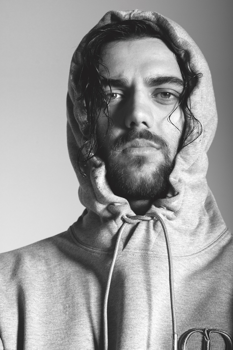 Italian swimmer Thomas Ceccon sports a gray Dior hoodie for Corriere della Sera Style.