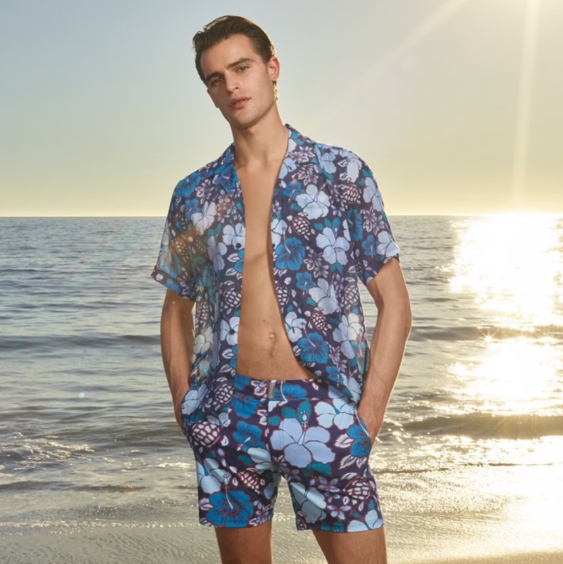 Showcasing summer style, Parker van Noord wears a matching shirt and swim shorts set by Vilebrequin.