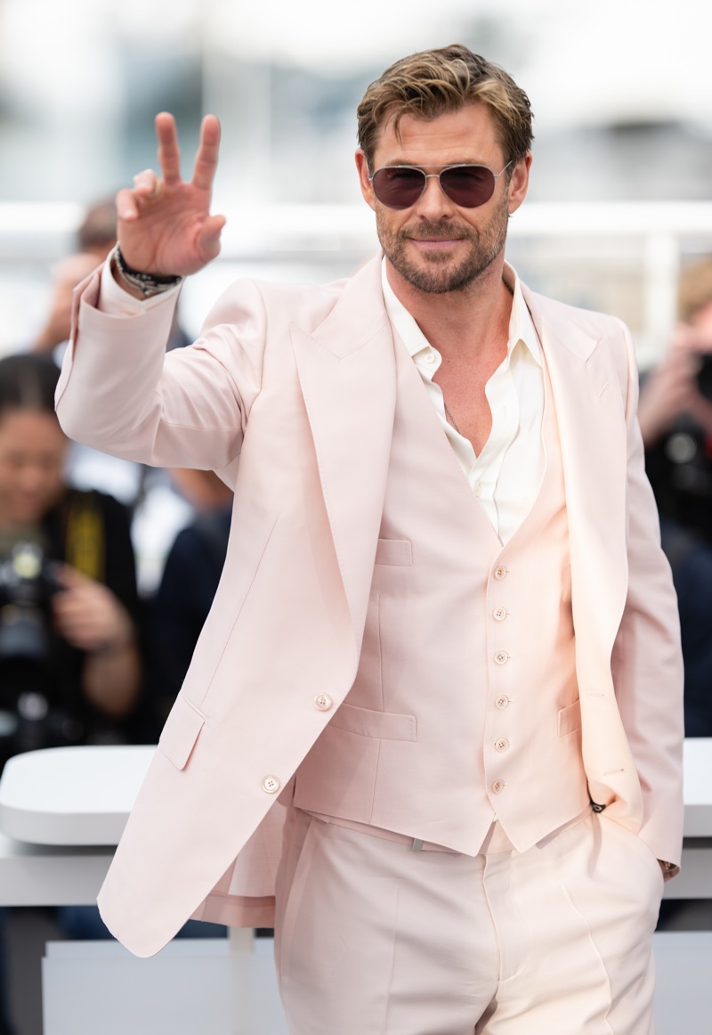 Photographed at the Cannes Film Festival, Chris Hemsworth dons a 3-piece Tom Ford suit in pink.