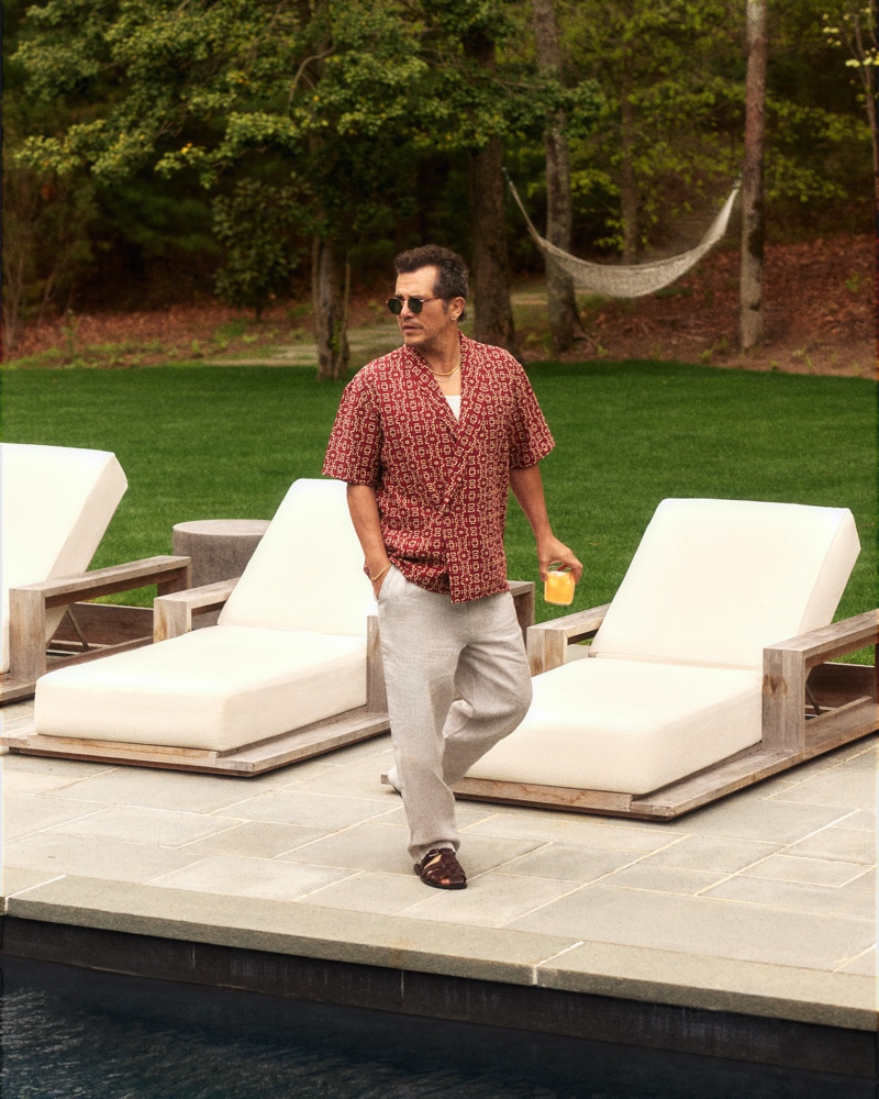 Actor John Leguizamo is pictured poolside as the star of Kith's summer 2024 advertisement.