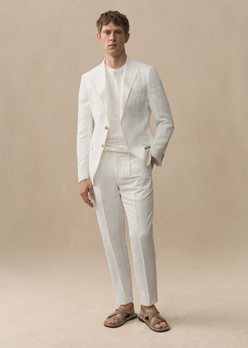 Mathias Lauridsen dons a white linen suit from Mango. 