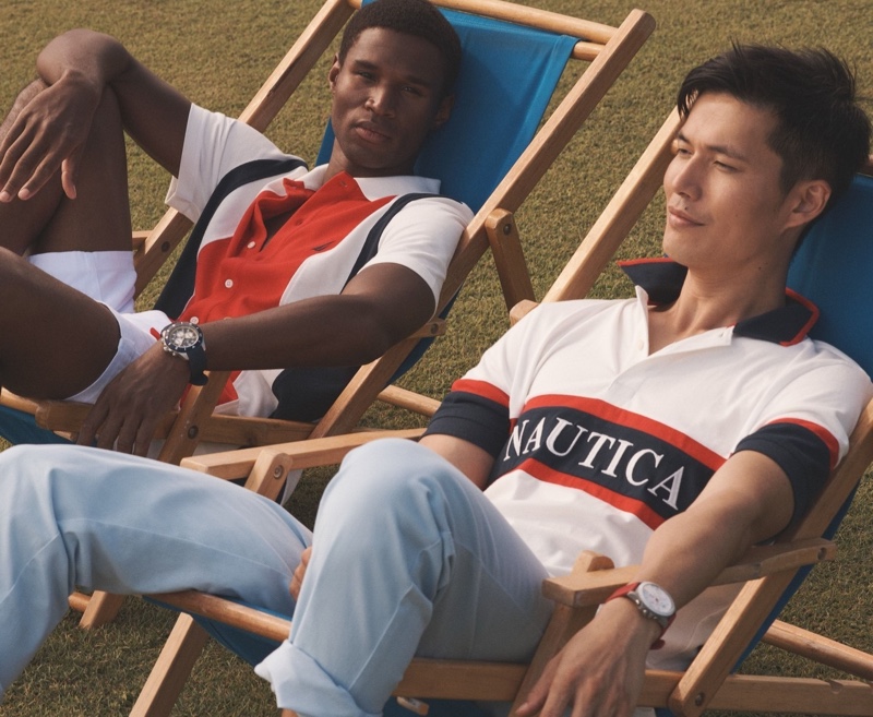 Models Henry Watkins and Dae Na sport polo shirts for Nautica's summer 2024 campaign. 