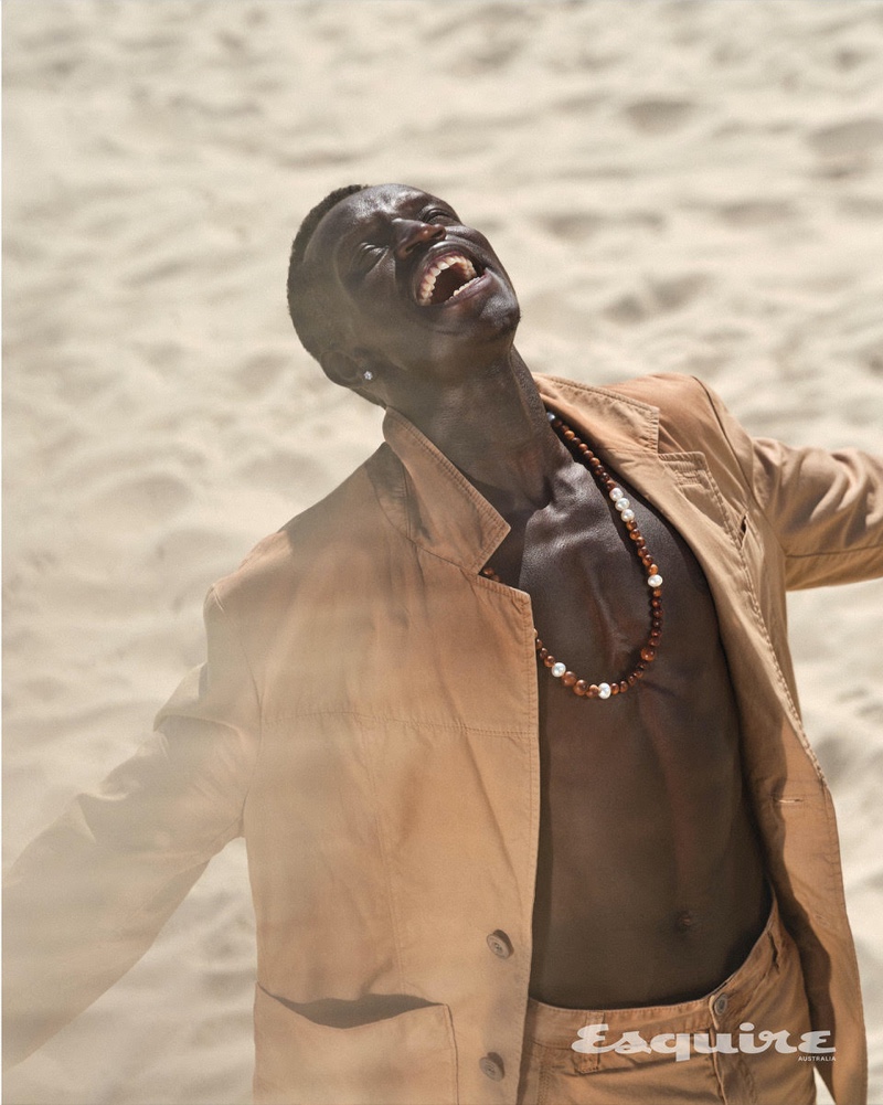 Donning a Coach jacket and pants, Peter Bol also wears a Paspaley necklace.