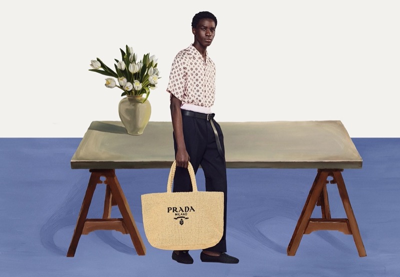 Ayo Hassan makes a statement with Prada's crochet tote bag for the brand's summer 2024 ad.