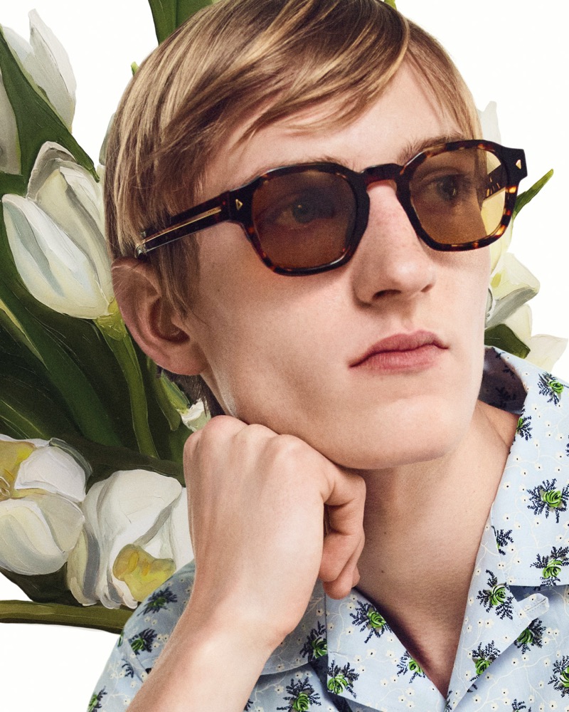 Sporting tortoiseshell sunglasses, Pierrick Grégoire fronts Prada's summer 2024 campaign. 