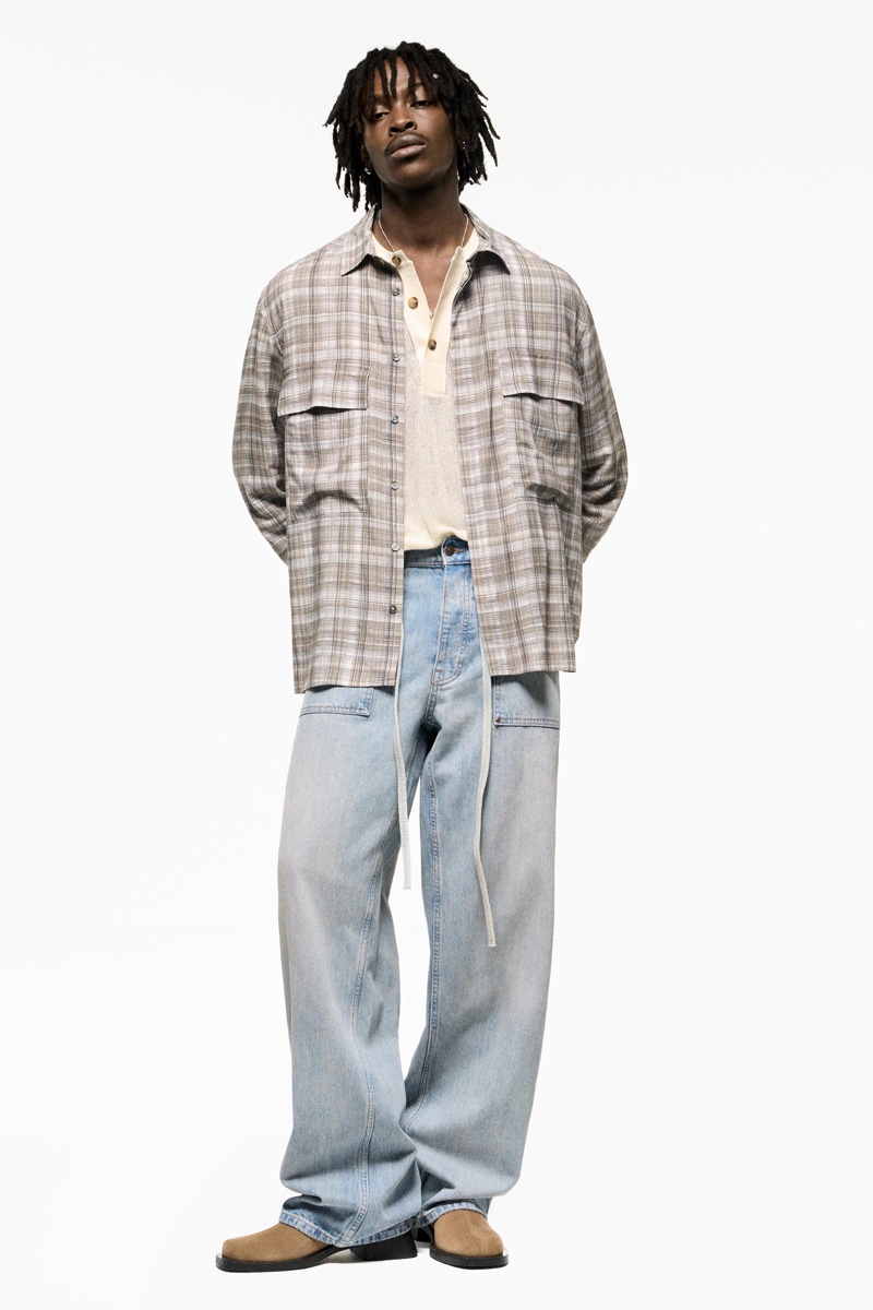 Zara embodies a nostalgic charm with its plaid overshirt and flared jeans. 