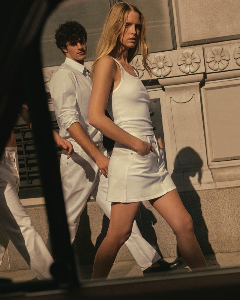Francesco Ruggiero and Abby Champion strut the city streets in Calvin Klein's all-white attire.
