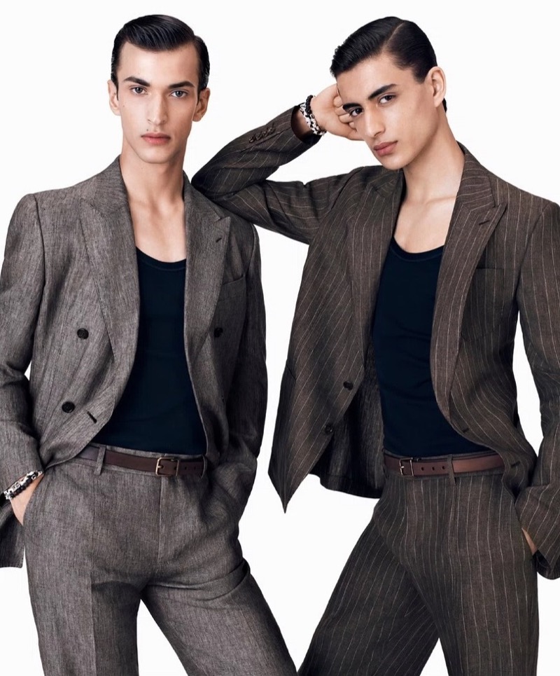 Habib Masovic and Yoesry Detre exude sharp sophistication in Dolce & Gabbana's Palermo collection, showcasing tailored grey suits. 
