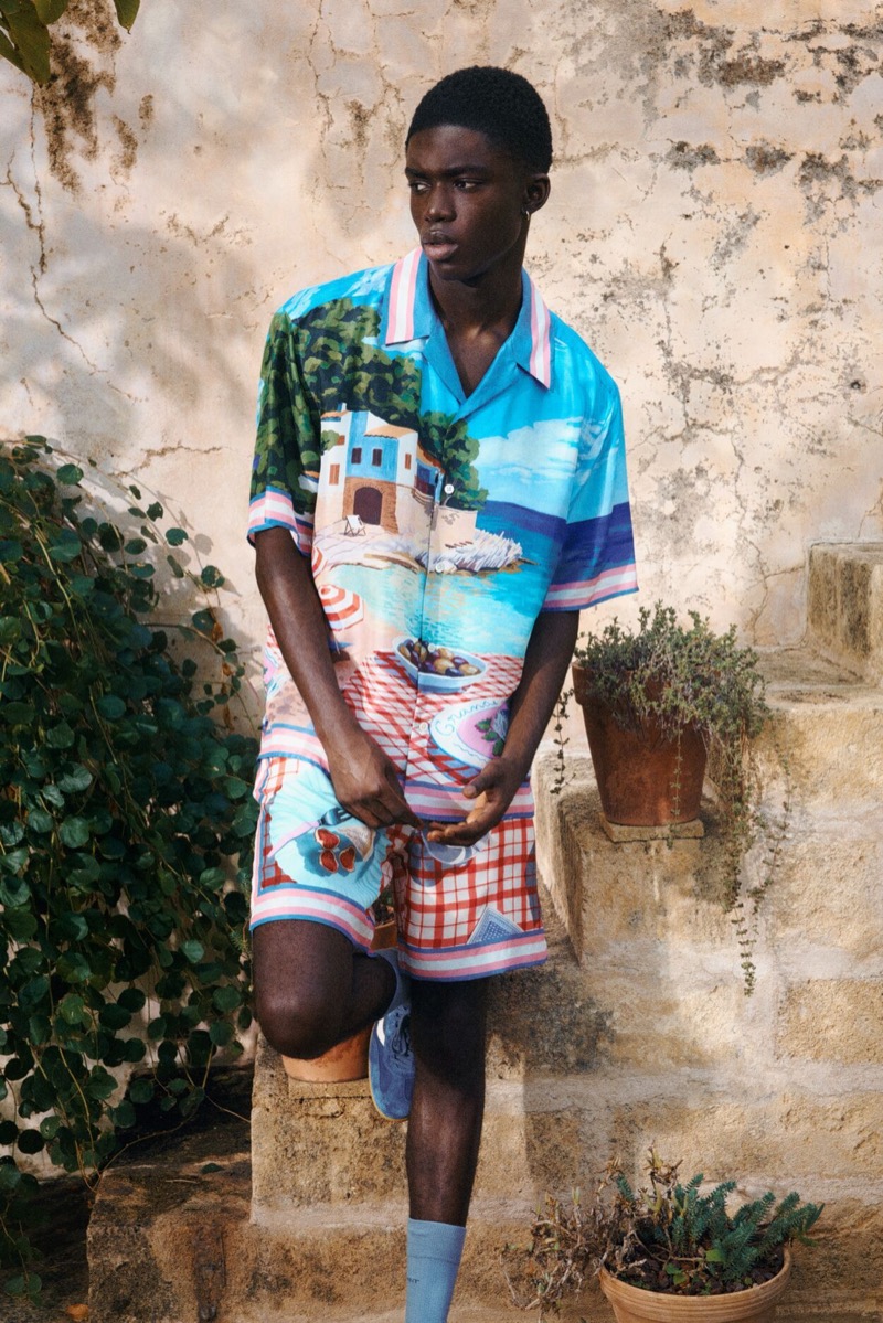 Showcasing a vibrant coastal print, Jeremiah Berko-Fourdjour stands out in GANT's colorful summer shirt and shorts set.
