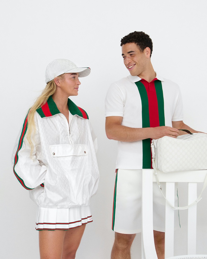 Emma Cohen and George Loffhagen share a moment in Gucci's tennis collection, wearing crisp white outfits adorned with the brand's iconic web.