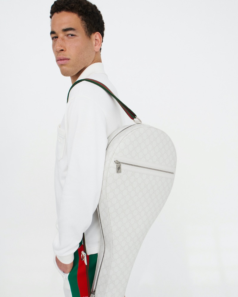 Tennis star George Loffhagen turns heads in Gucci's tennis collection, carrying a stylish racket bag.