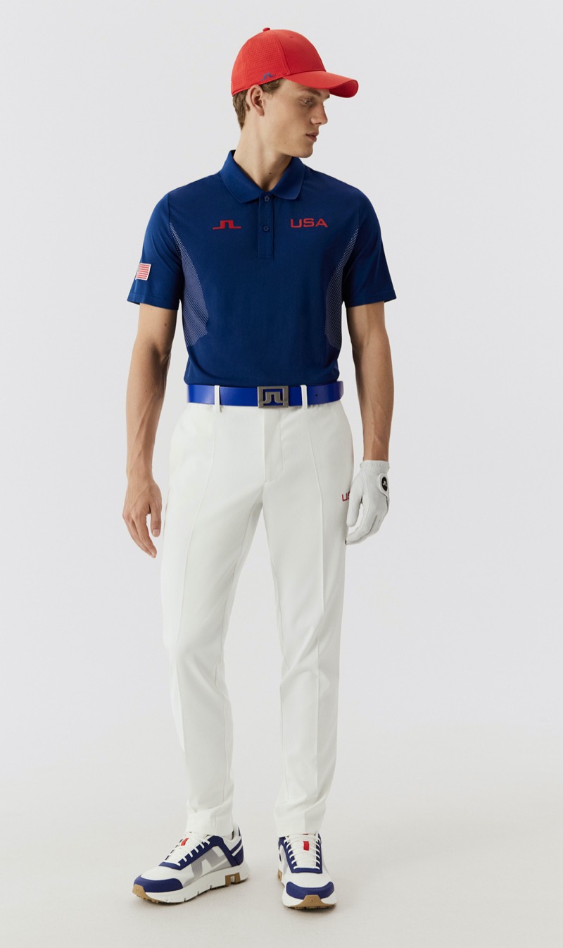 Elegance meets athleticism as the U.S. Olympic golf team dons a deep blue polo with white trousers accented by bold red details, courtesy of J.Lindeberg.